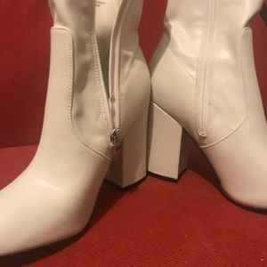 White block heeled booties.